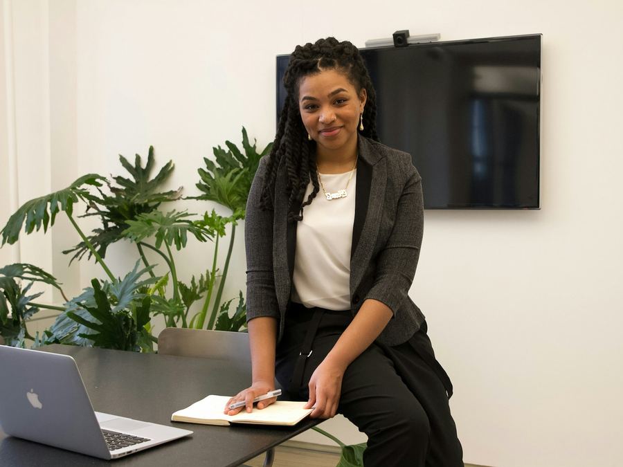 Business owner working at her laptop after getting her business registered